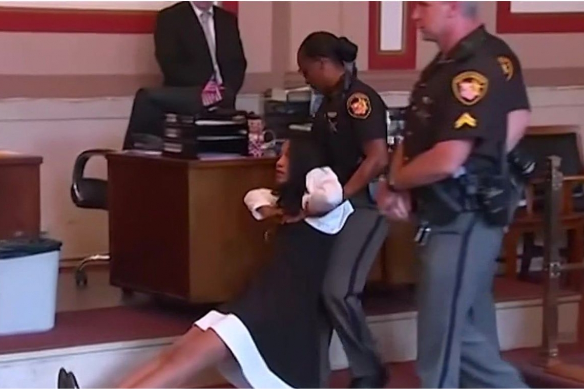 A former Ohio judge was dragged from court after her sentencing